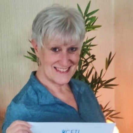 Janice Andrzejewski, CETI graduate, holding her certificate